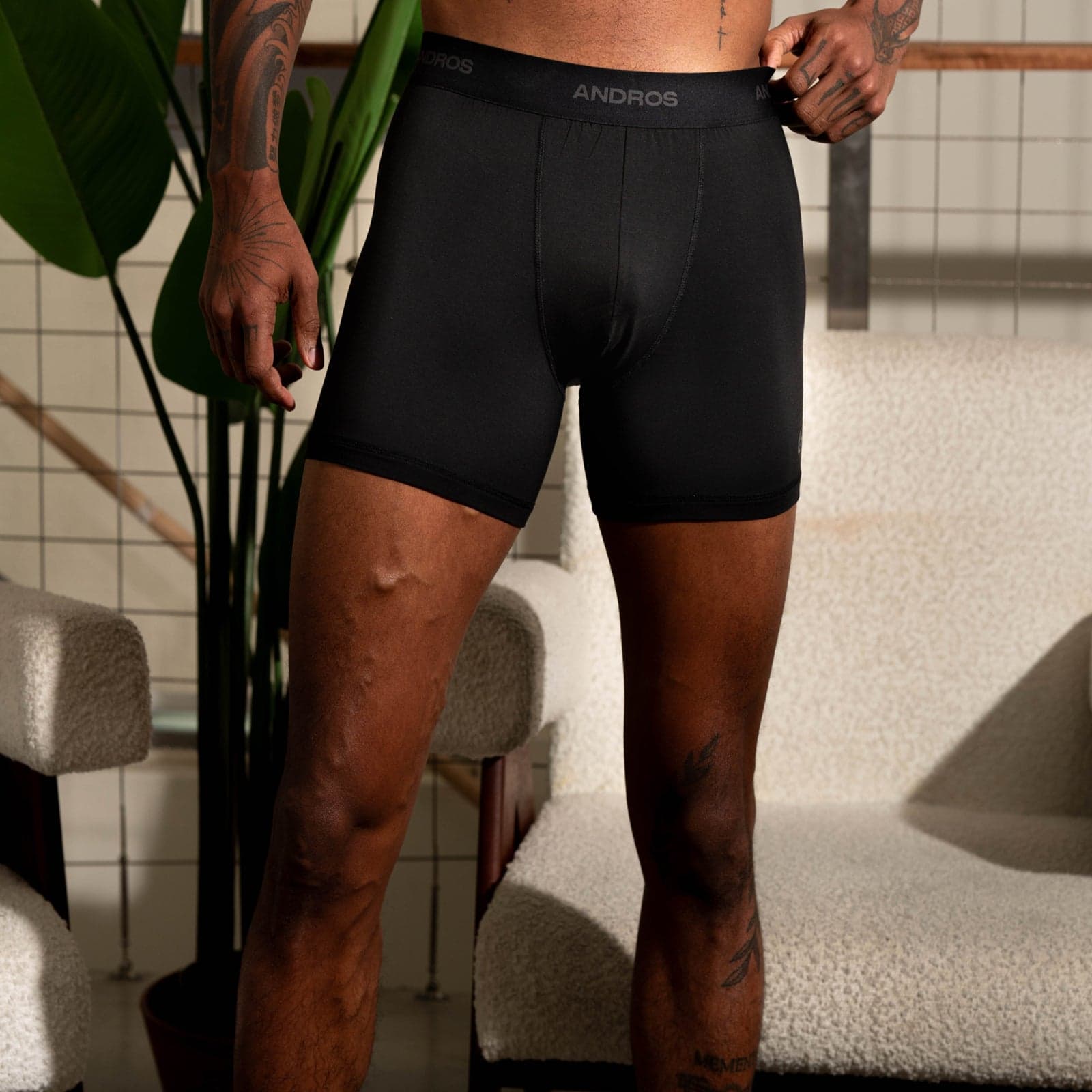 Model wearing black ANDROS Weightless boxer briefs