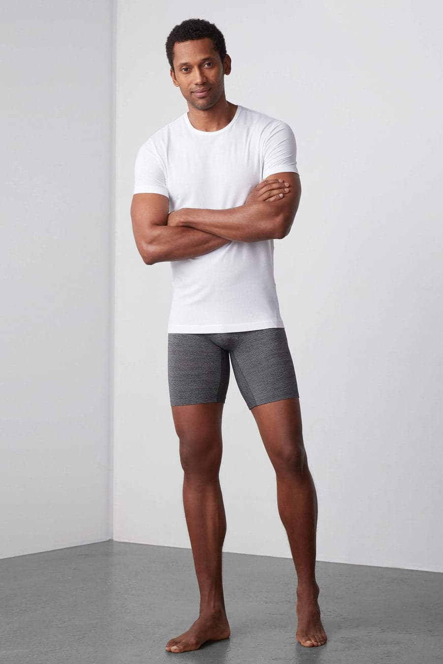Model wearing grey Mack Weldon AIRKNITx boxer briefs