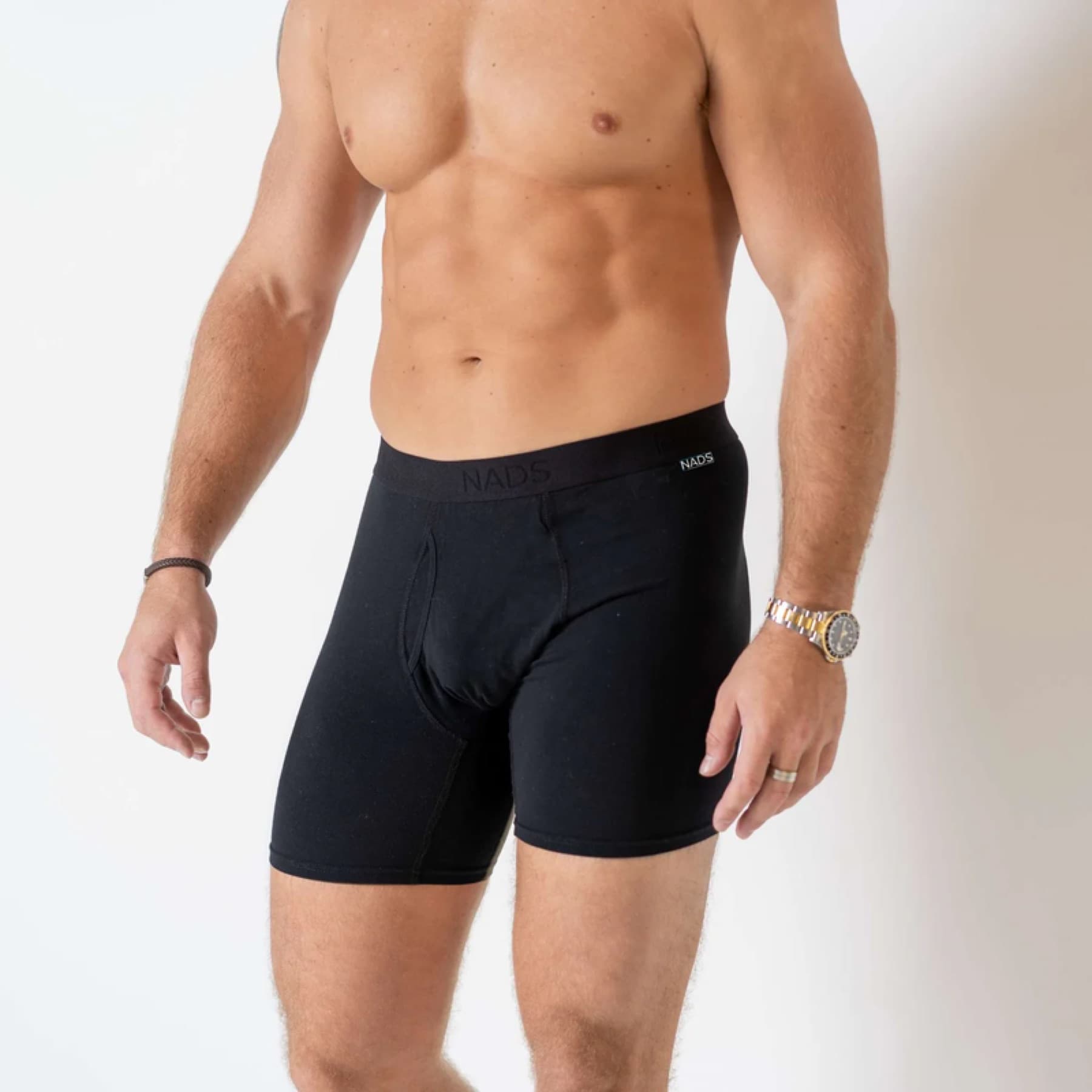 Model wearing black NADS organic cotton boxer briefs