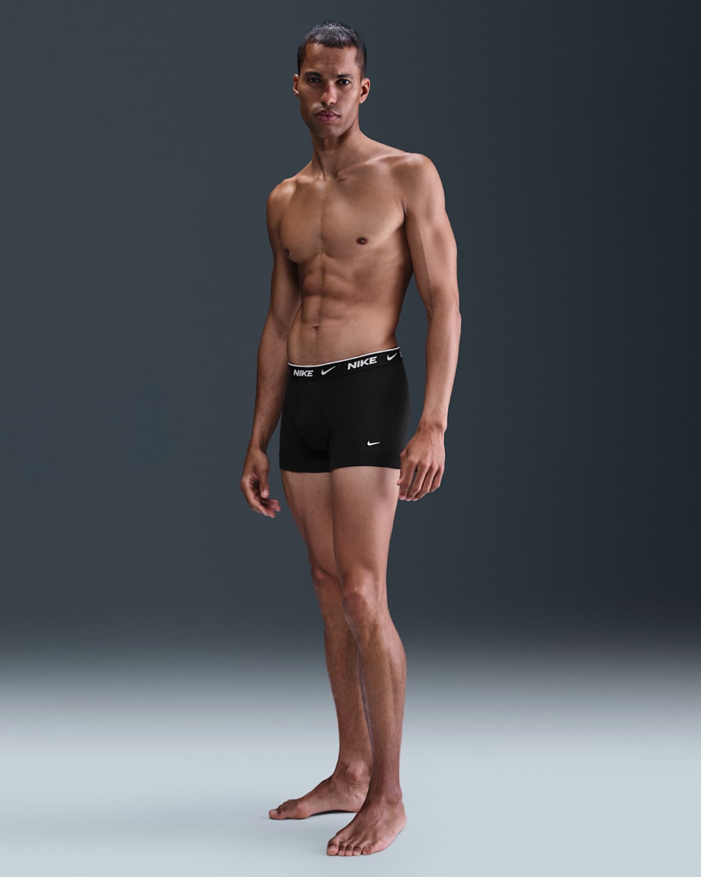 Model wearing black Nike Dri-FIT Essential boxer briefs