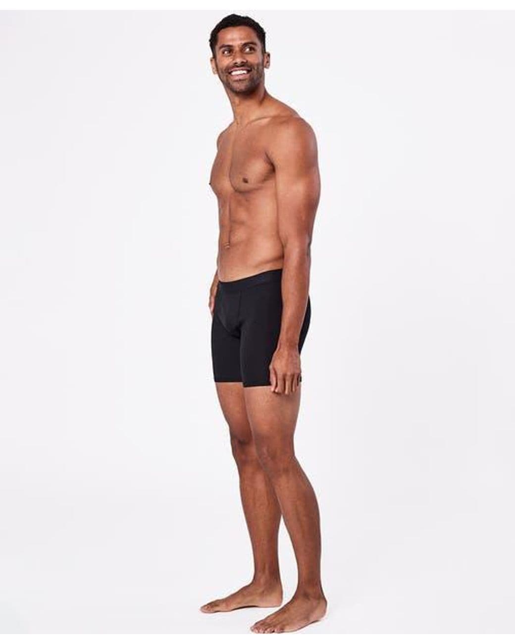 Model wearing black Pact Everyday organic cotton boxer briefs