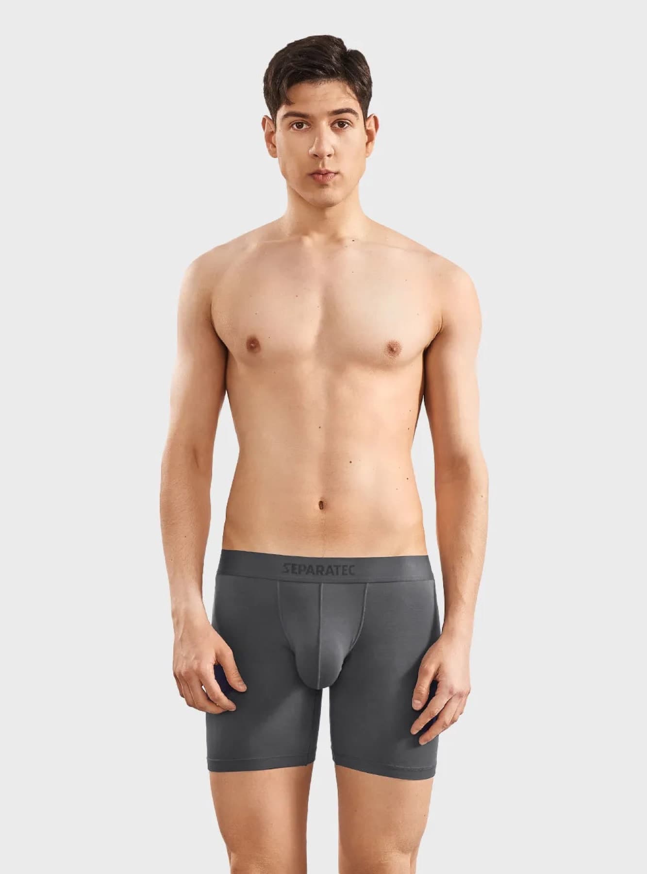 Model wearing grey Separatec dual-pouch boxer briefs