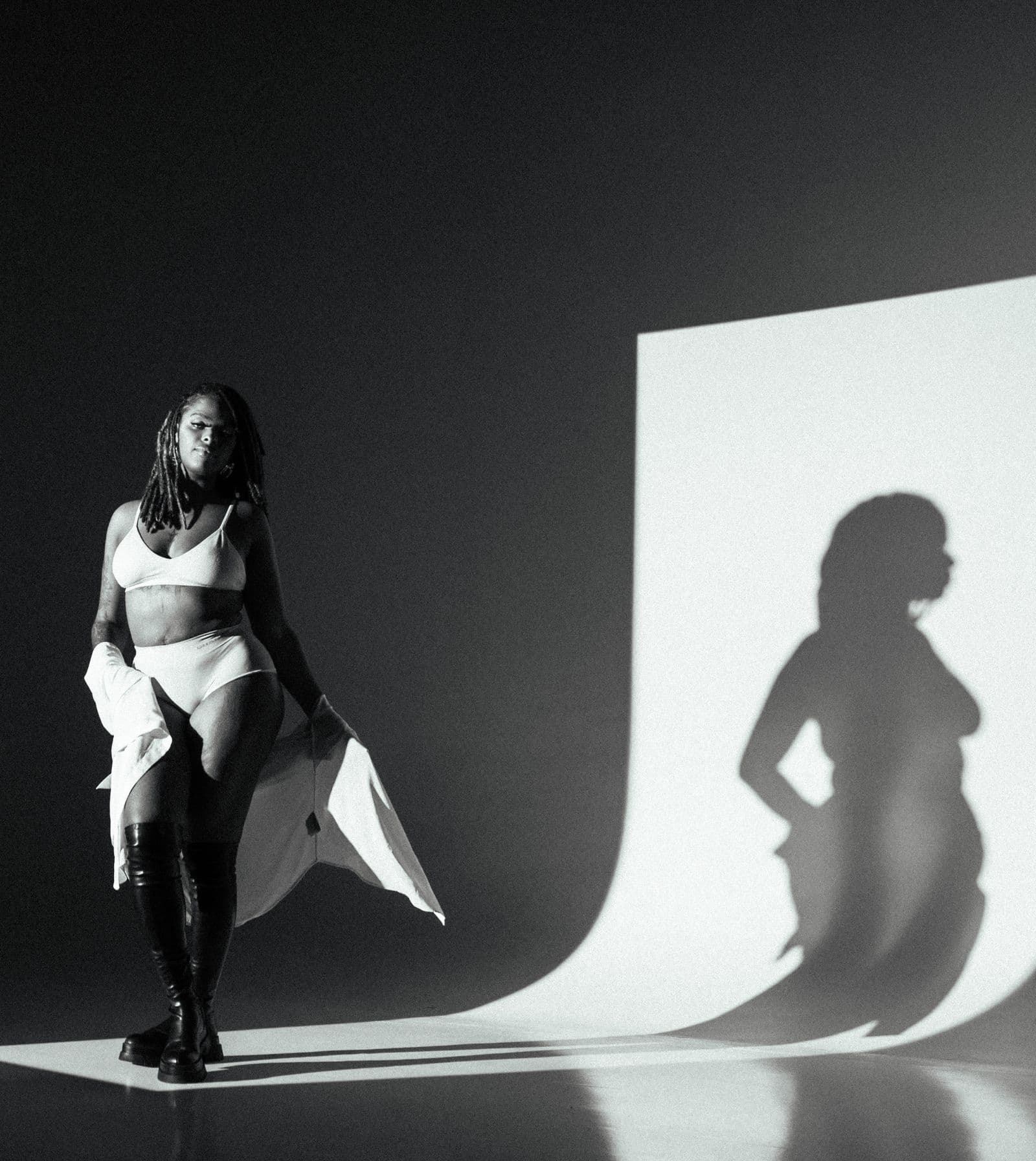 Women posing confidently in underwear in a studio portrait